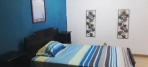Desk, laptop workspace, bed sheets