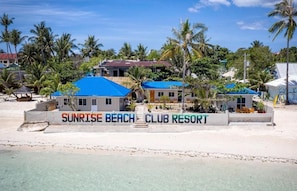 White sand, beach towels