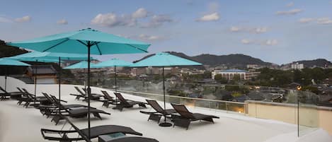 Seasonal outdoor pool, cabanas (surcharge), pool umbrellas