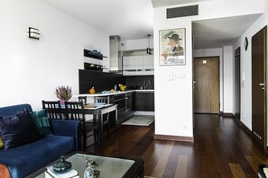 City Apartment | Living area | 40-inch LCD TV with satellite channels, TV