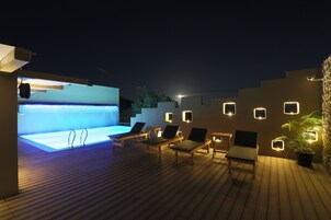 Outdoor pool, open 8:00 AM to 8:00 PM, pool umbrellas, pool loungers