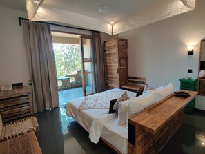 Premium Room With Balcony | Living area | 42-inch LED TV with cable channels, TV, fireplace
