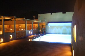 Outdoor pool, open 8:00 AM to 8:00 PM, pool umbrellas, pool loungers