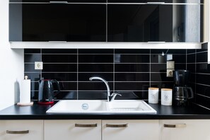 Loft (4th Floor) | Private kitchenette | Full-sized fridge, coffee/tea maker, electric kettle - Thresh Apartments Airport by Airstay (Spata-Artemida)