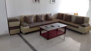 Basic Apartment, 2 Bedrooms | Living area | 32-inch flat-screen TV with cable channels, TV