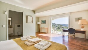 A hotel room with a bed, a desk, a chair, a balcony with a view, and a bathroom. - CENTRAL and Renovated. PANORAMIC SEA VIEWS. Garden (Sainte-Maxime)