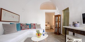 Apartment, 1 Bedroom (Cave) | Living area | 32-inch flat-screen TV with satellite channels, TV, streaming services - Arvanitis Cave Village (Santorini)