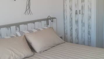 Desk, laptop workspace, free WiFi, bed sheets