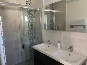 Shower, hair dryer, towels, soap