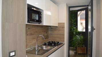 Classic Quadruple Room | Private kitchen | Mini-fridge, electric kettle