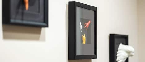A wall with three framed artworks.