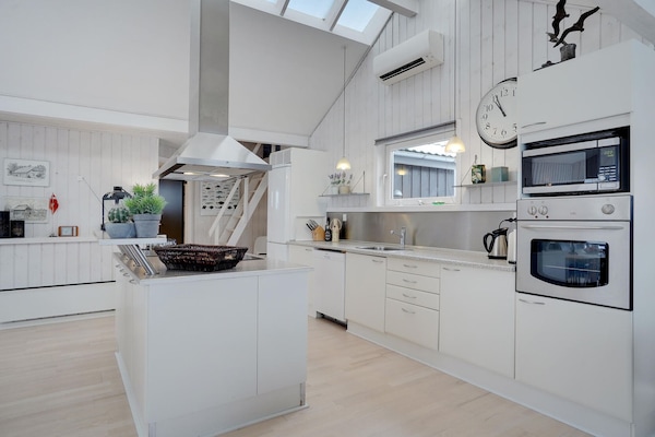 Fridge, stovetop, dishwasher, coffee/tea maker