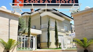 The entrance to Sokrat Hotel with a clear sign, a gated entrance, and a well-maintained exterior. - Sokrat Hotel (Tirana)