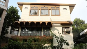 A two-story building with a balcony, large windows, and a flat roof. - Hotel Park View (Bhopal)