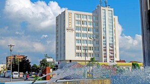 A hotel with a modern facade, multiple floors, and a prominent sign. - Rozafa Hotel (Shkodër)
