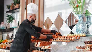 A buffet with various pastries and desserts.
