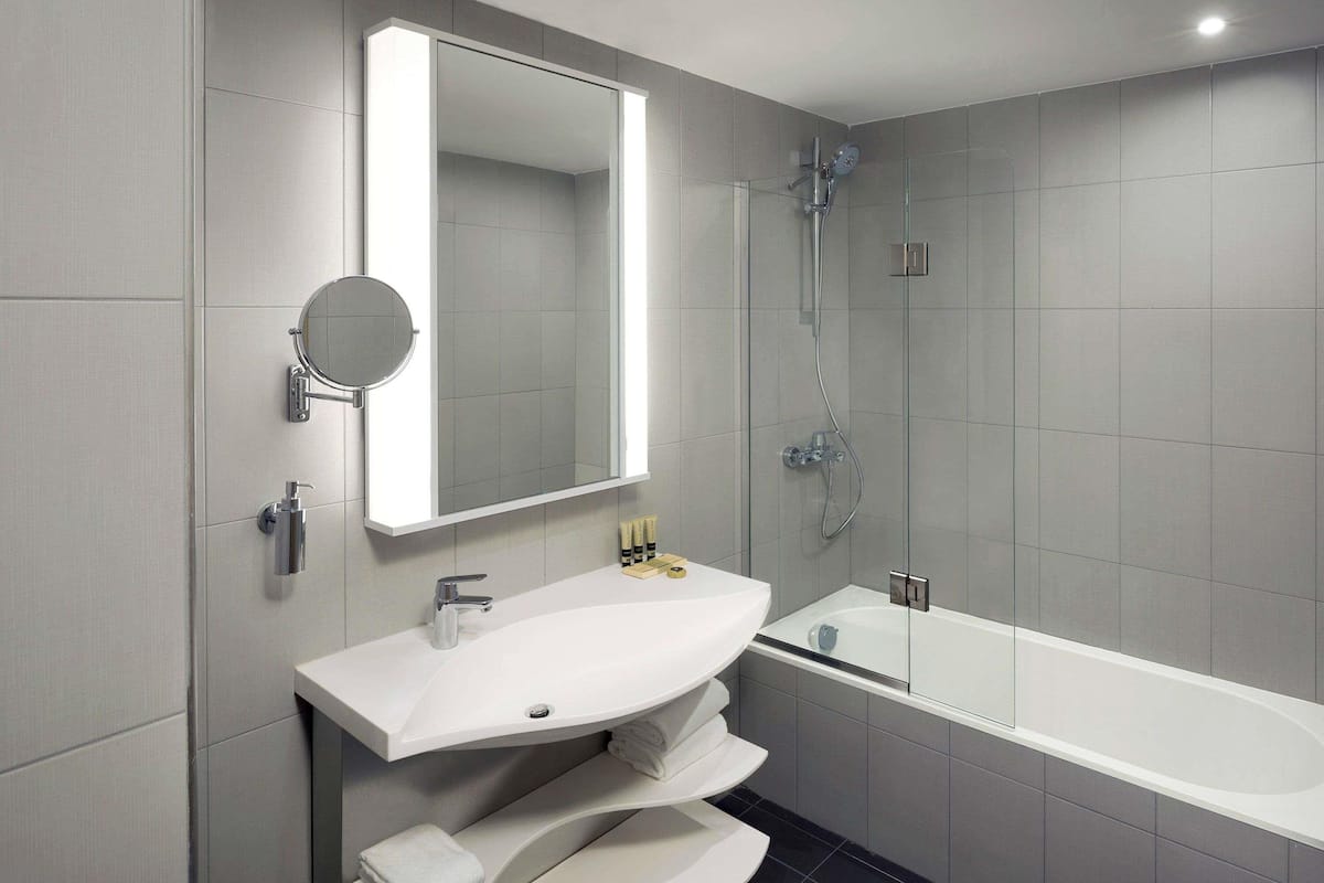 Eco-friendly toiletries, hair dryer, slippers, towels