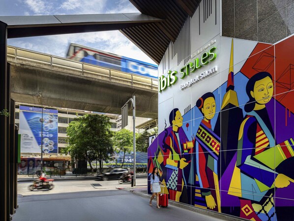 A building with a colorful mural and the text 'ibis Styles Bangkok Style'. - ibis Styles Bangkok Silom (Bangkok)