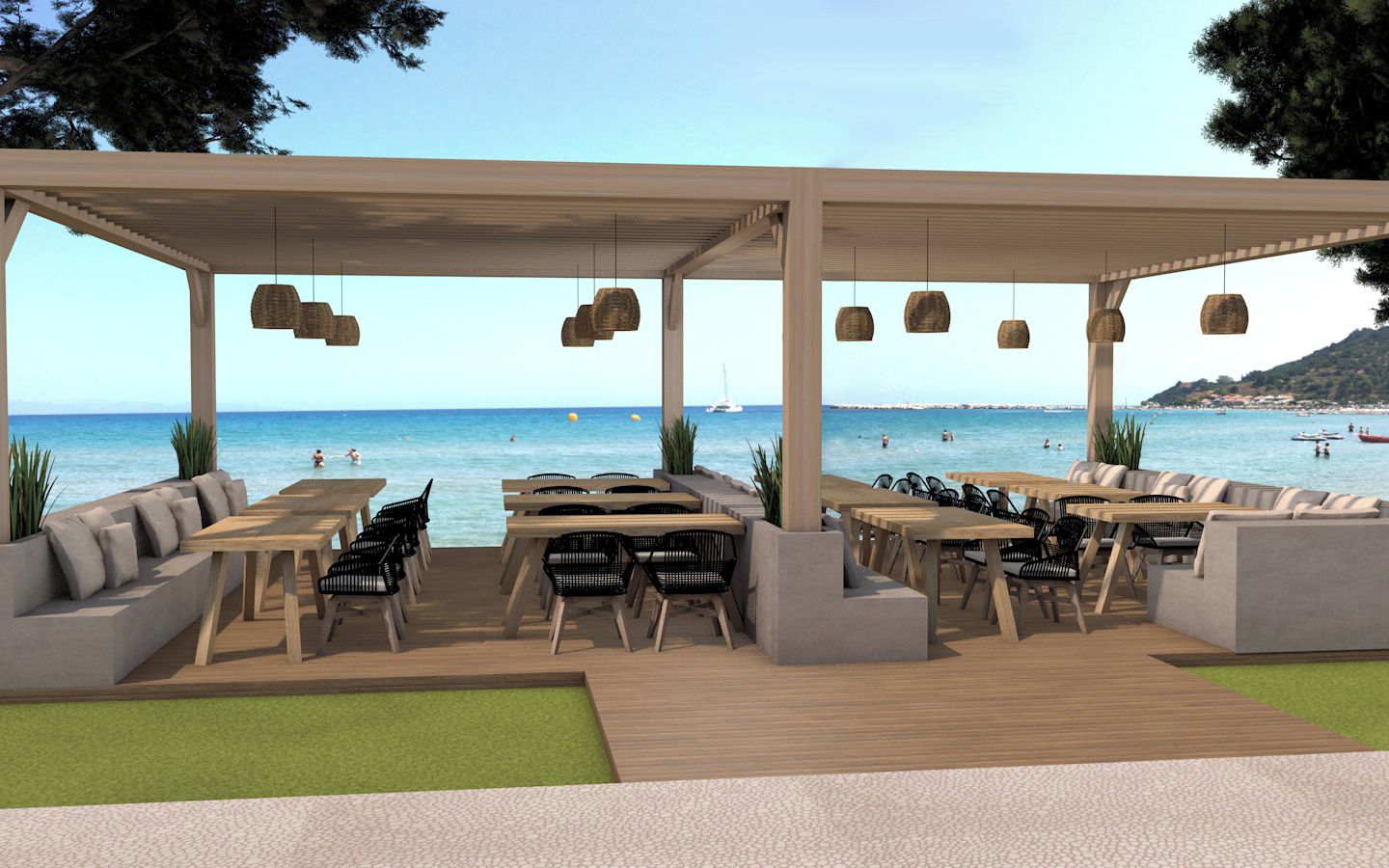 An outdoor seating area with tables and chairs, overlooking a beach with boats and people.
