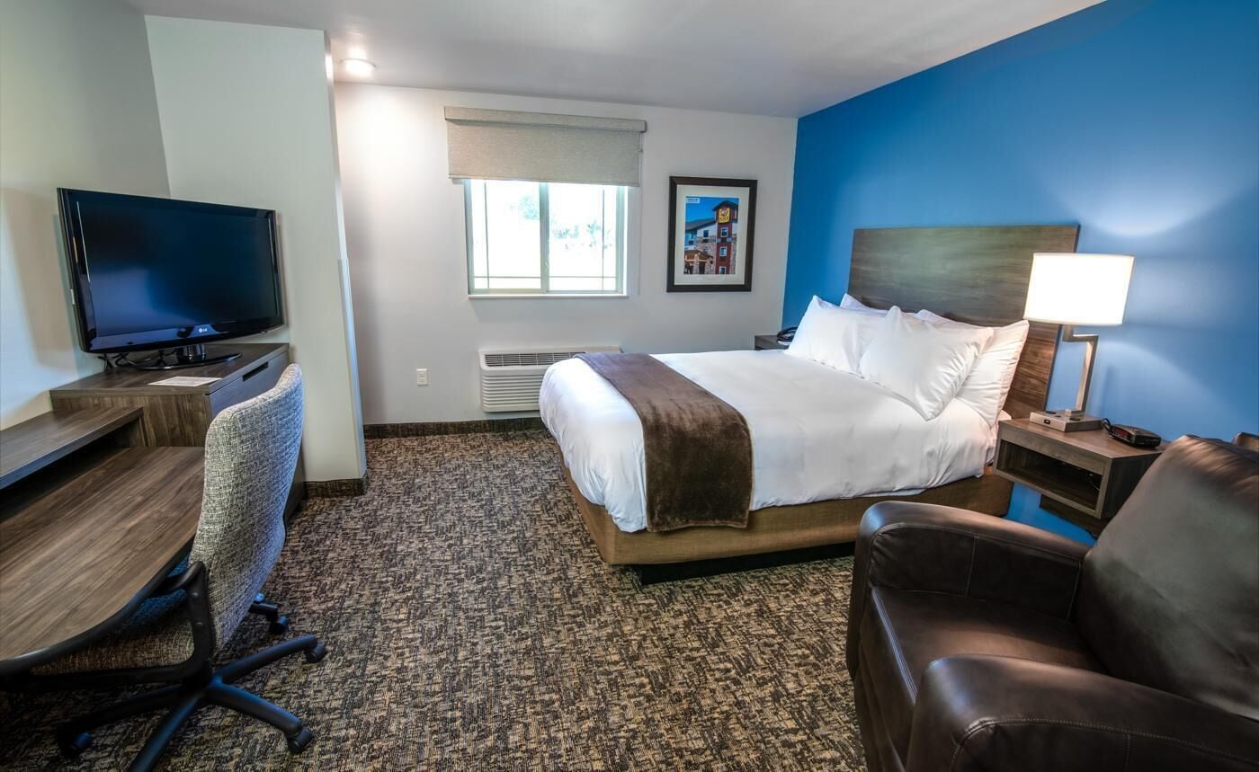 Premium bedding, pillow-top beds, desk, laptop workspace