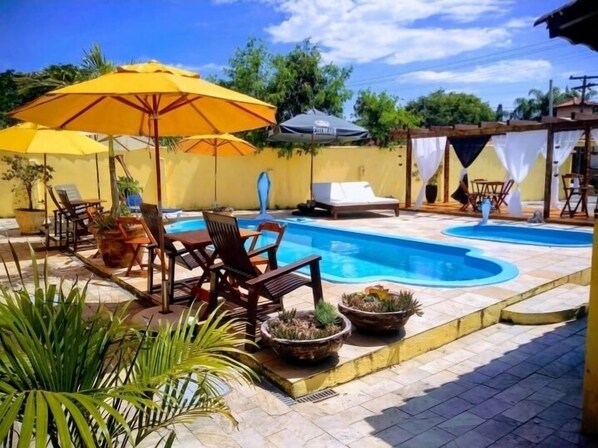2 outdoor pools, open 9:30 AM to 7:00 PM, pool umbrellas, pool loungers