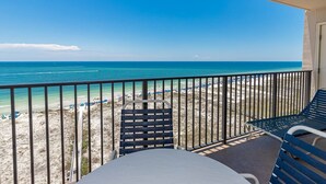 A balcony with a view of a beach and ocean. - Orange Beach Alabama, 1 Bedroom Phoenix East 22102 (Orange Beach)