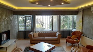 Apartment 1 Bedroom | Living room | 43-inch Smart TV with satellite channels, TV, MP3 dock