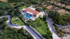 An aerial view of a Mediterranean-style villa with a swimming pool, terraced garden, and stone walls. - Heated pool + hydro-massage ★ Sea view ★ Near Falasarna (Phalasarna)