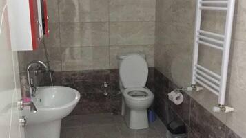 Family Apartment, 2 Bedrooms, Garden View, Garden Area | Bathroom | Shower, hair dryer, bathrobes, slippers