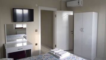 Family Apartment, 2 Bedrooms, Garden View, Garden Area | 2 bedrooms, desk, laptop workspace, iron/ironing board