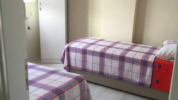 Family Apartment, 2 Bedrooms, Garden View, Garden Area | 2 bedrooms, desk, laptop workspace, iron/ironing board