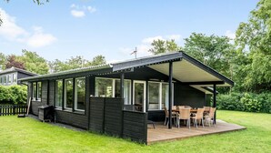 A modern, single-story house with a covered patio area. - Amazing home in Hjerm with house a panoramic view (Hjerm)