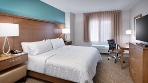 A hotel room with a large bed, bedside tables, a desk, a chair, a television, and a window with curtains. - Free Breakfast. Pool & Hot Tub. Gym. Near Traverse Mountain Shopping Center! (Lehi)