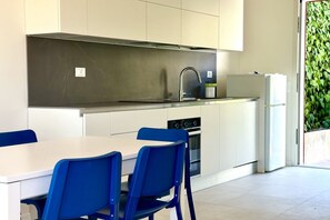 Fridge, oven, dining tables