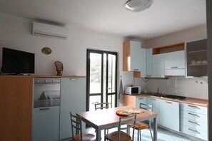 Fridge, oven, freezer, dining tables