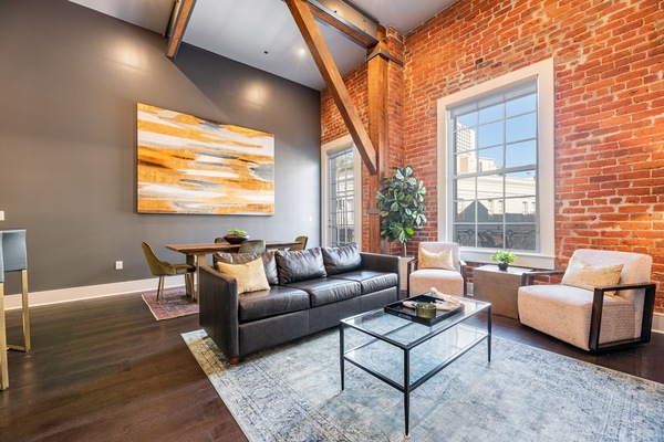 Open concept living, kitchen, and dining area with comfortable seating for you and your guests. 65” Samsung Smart 4K TV for streaming apps and DIRECTV. Sofa converts to a queen-size sleeper. Dining table for four. Lots of natural light!