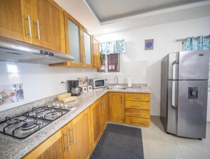 Fridge, microwave, stovetop, coffee/tea maker