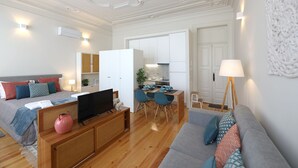 Un apartamento moderno con sala de estar, comedor y kitchenette.