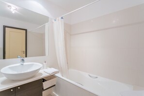 Bathtub, hair dryer, towels
