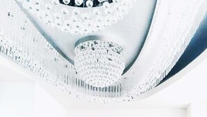 A ceiling with a decorative, geometric pattern. - Sun Hotel (Tokyo)