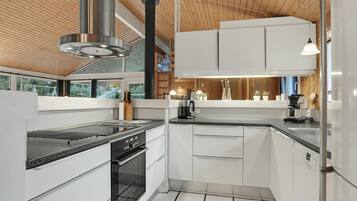 Fridge, stovetop, dishwasher, coffee/tea maker