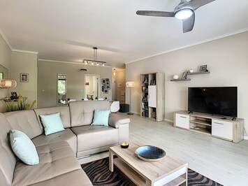 Inviting contemporary living with Smart TV #livingroom # sofa #spacious #luxury