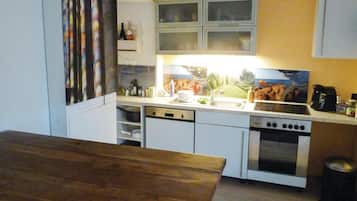 Fridge, stovetop, dishwasher, coffee/tea maker