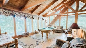 A spacious room with a pool table, two sofas, and a lamp. - Big Kahuna Lodge 3 Bedroom Cabin by RedAwning (Sevierville)