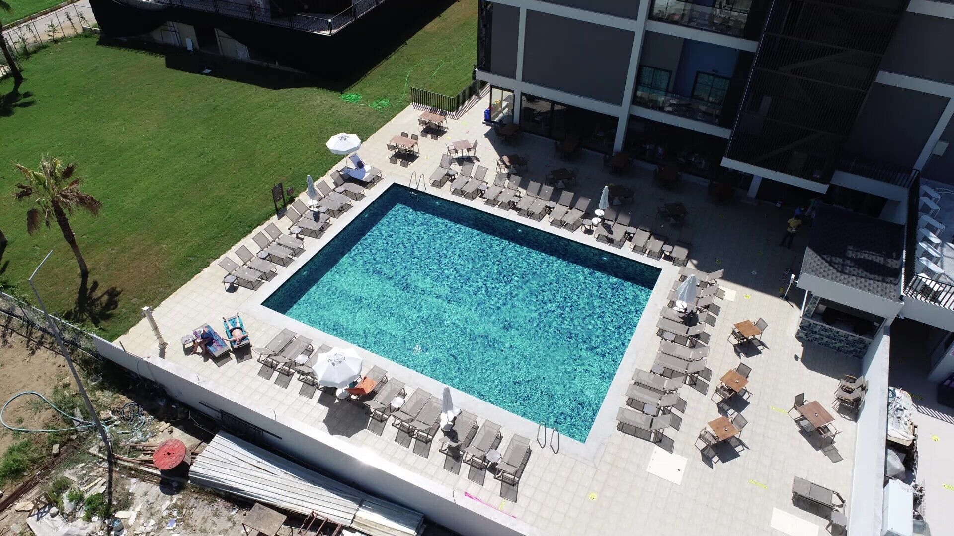 seasonal outdoor pool, open 8:00 am to 7:00 pm, pool umbrellas