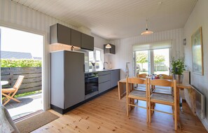 Fridge, stovetop, dishwasher, coffee/tea maker