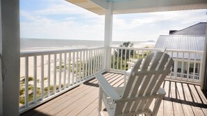 A wooden deck with a white chair facing a beach view. - "No Pressure"  Beautiful beach front home (Port St Joe)