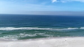 A beach with clear blue water and a sandy shore. - Premier Partner Oceanfront Edgewater Condo With Full Amenities (Panama City)