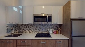 Fridge, microwave, stovetop, coffee/tea maker