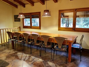Enjoy meals in this cozy dining area with a long table and six comfortable chairs.